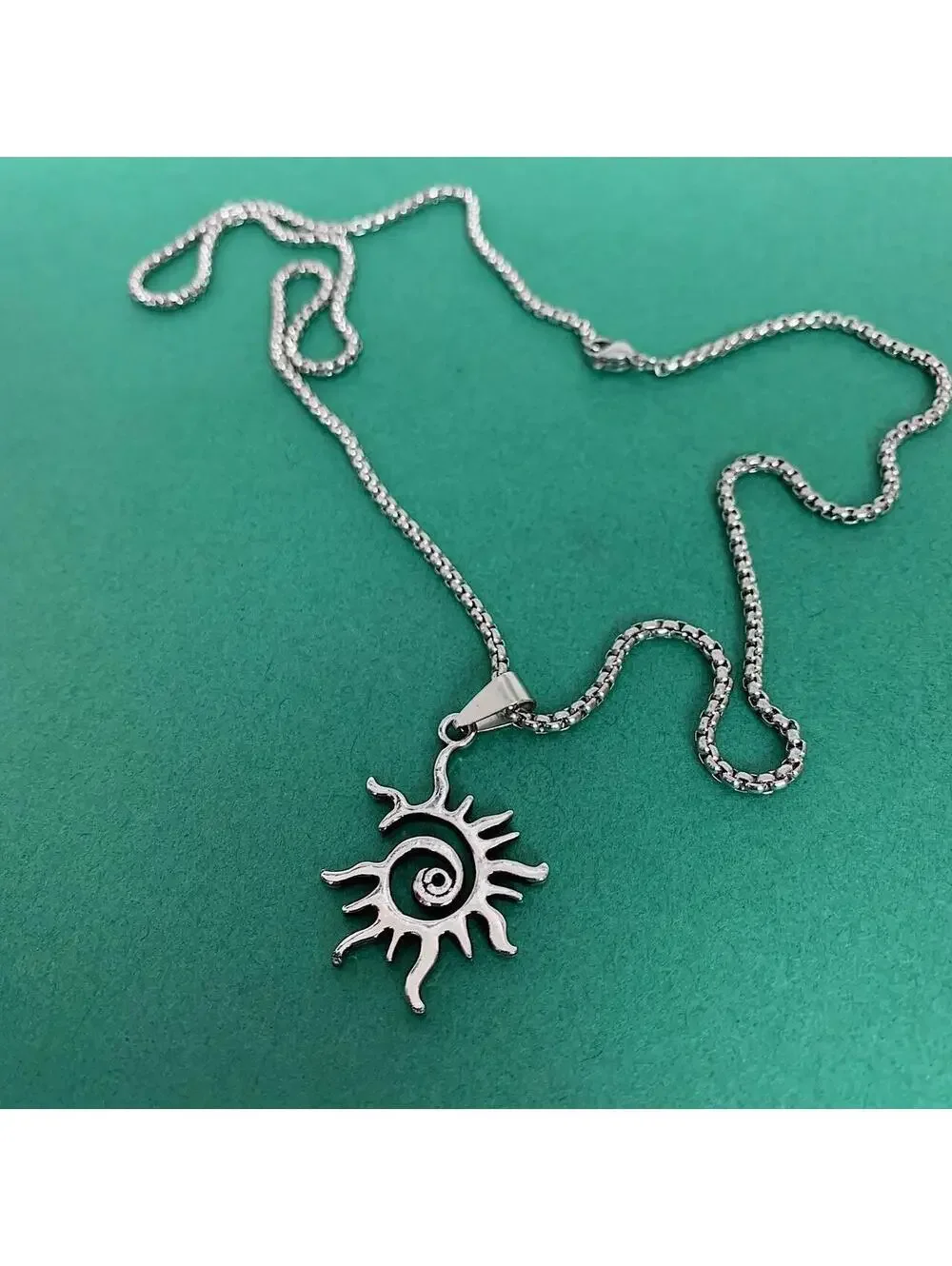 Swirling Sun Pendant Stainless Steel Silver necklace. Unisex